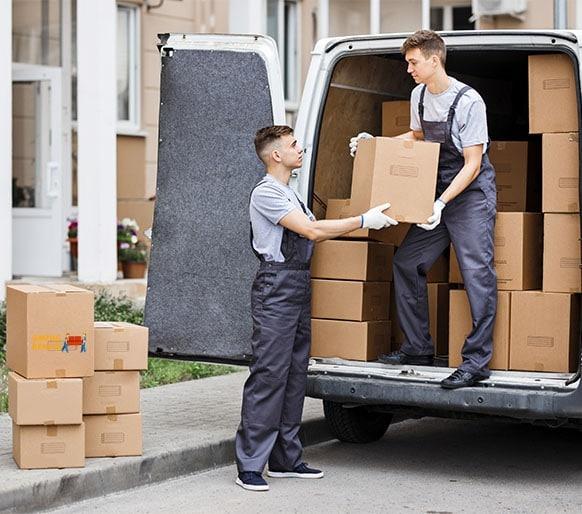 two-young-handsome-movers-wearing-uniforms-are