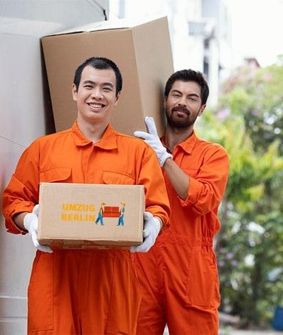 young-delivery-men-moving-parcel
